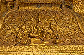 Luang Prabang, Laos - Wat Mai, the gilded stucco engravings of the veranda. 